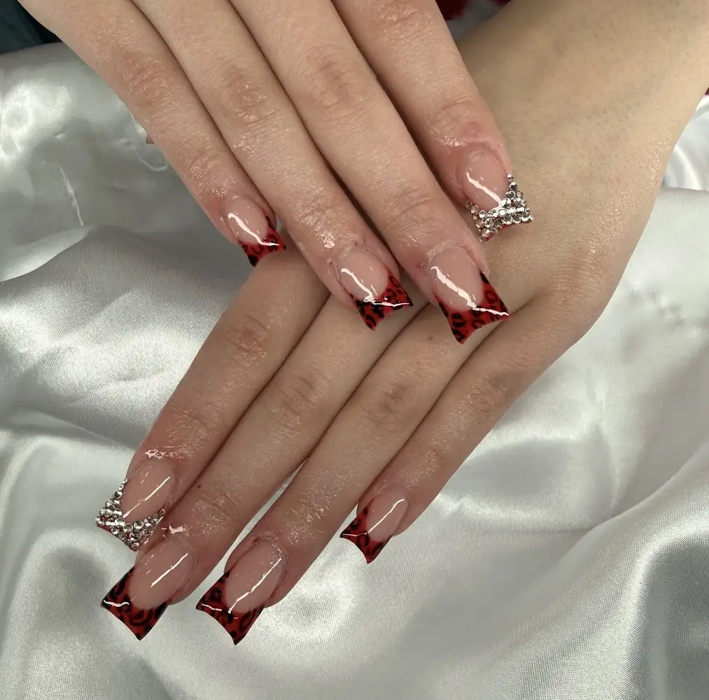 Red jeweled French tip nails at Brooklyn Nail Bar